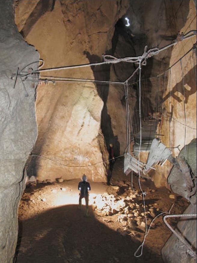 Buddy admires the remains of a cable bridge, part of the
donkey walkway. Cueva del Hundidero