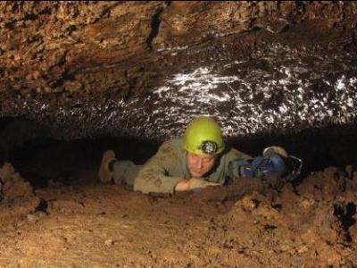 Typical flat out crawling in the upper level linking Cueva del
Sobrado and Cueva de las Breveritas