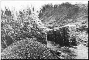 Damage to the causeway. Looking upstream. <Photo attributed to Charterhouse Centre