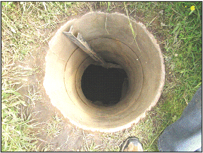 Concrete pipes lining the entrance, photo B Chadwick