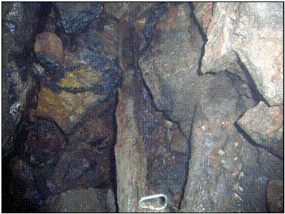 Rotten timbers in the shaft at -30m. Photo B Chadwick